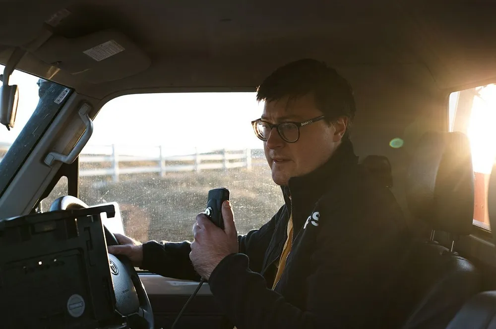 Russell Buzby on the radio in a NSW RFS vehicle