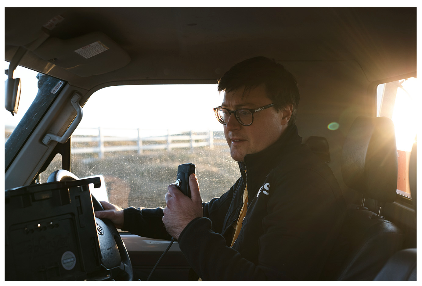 Russell Buzby on the radio in an NSW RFS vehicle